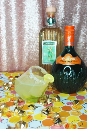 A homemade zesty citrus (lime & orange!) margarita recipe enhanced with raw honey for the perfect tart alcoholic drink on Home in High Heels