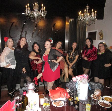 Strappy red dress with red bralette, Bacino Design striped black & white cardigan sweater, chunky studded boots, & read leather studded bag curvy OOTD Black, White, Red, & French! Oh La La Bistro Restaurant Recap in Las Vegas with Christmas in Paris Little Red Dress Curvy OOTD on Home in High Heels