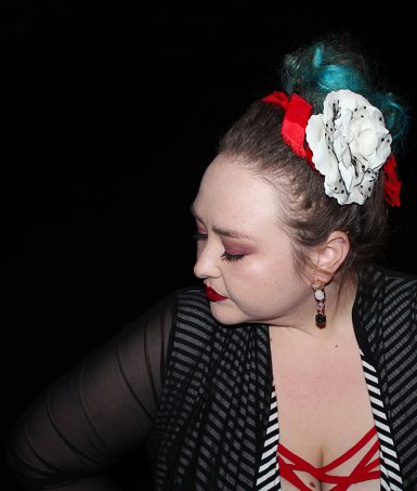 Strappy red dress with red bralette, Bacino Design striped black & white cardigan sweater, chunky studded boots, & read leather studded bag curvy OOTD Black, White, Red, & French! Oh La La Bistro Restaurant Recap in Las Vegas with Christmas in Paris Little Red Dress Curvy OOTD on Home in High Heels