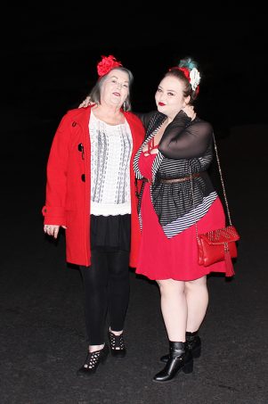 Strappy red dress with red bralette, Bacino Design striped black & white cardigan sweater, chunky studded boots, & read leather studded bag curvy OOTD Black, White, Red, & French! Oh La La Bistro Restaurant Recap in Las Vegas with Christmas in Paris Little Red Dress Curvy OOTD on Home in High Heels