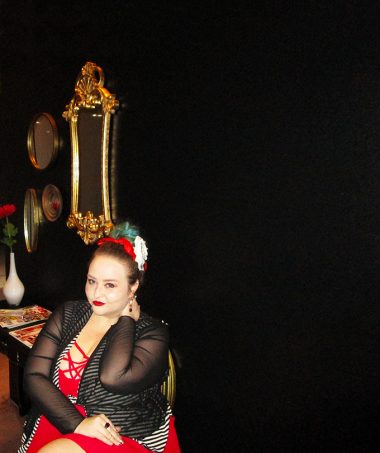 Strappy red dress with red bralette, Bacino Design striped black & white cardigan sweater, chunky studded boots, & read leather studded bag curvy OOTD Black, White, Red, & French! Oh La La Bistro Restaurant Recap in Las Vegas with Christmas in Paris Little Red Dress Curvy OOTD on Home in High Heels