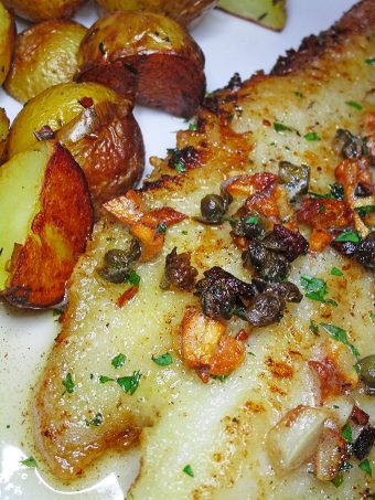SOLE MEUNIèRE Panseared sole in brown butter with garlic, capers, lemon and parsley Black, White, Red, & French! Oh La La Bistro Restaurant Recap in Las Vegas with Christmas in Paris Little Red Dress Curvy OOTD on Home in High Heels